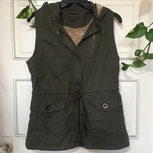 A fuzzy olive green vest